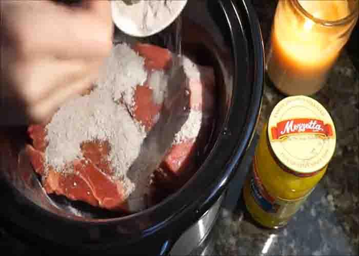 Rubbing the pot roast with the seasoning mixture