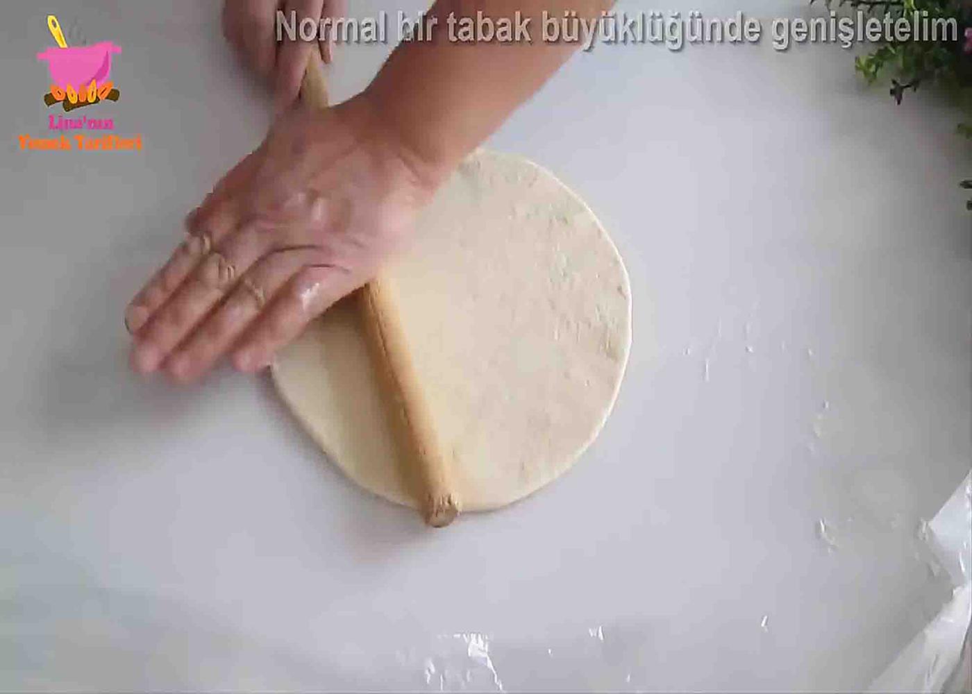 Flatting out the dough for the fluffy bread skillet recipe