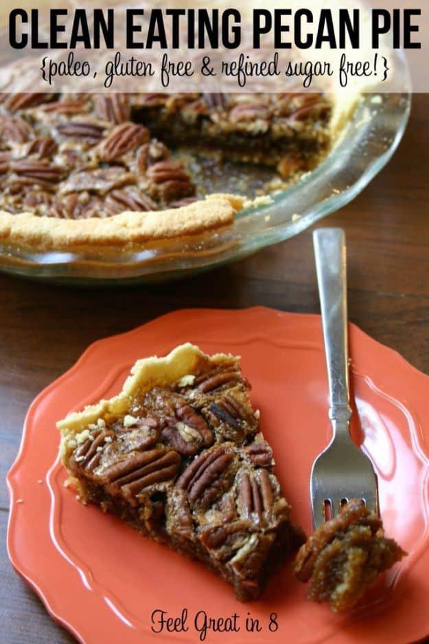Clean eating pecan pie with an almond flour crust, pecan halves crowded across the top, sliced on a plate