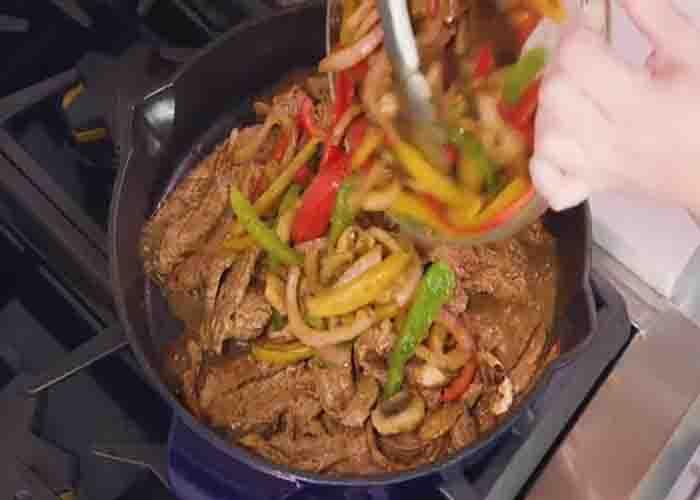 Combining the veggies and the fajita steak in one pan