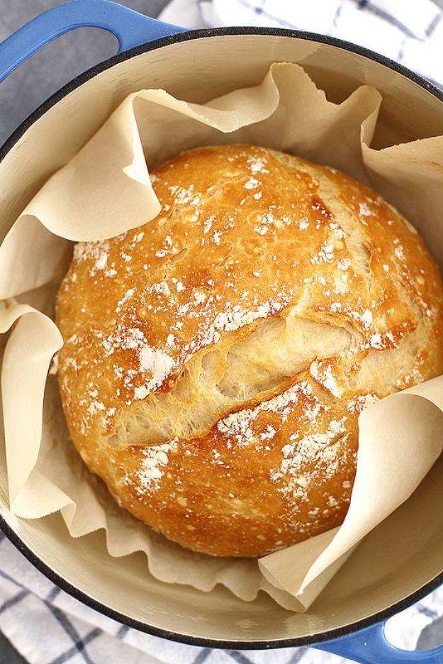 No knead dutch oven bread with an open crumb and a dark crackly crust from a preheated cast iron pot