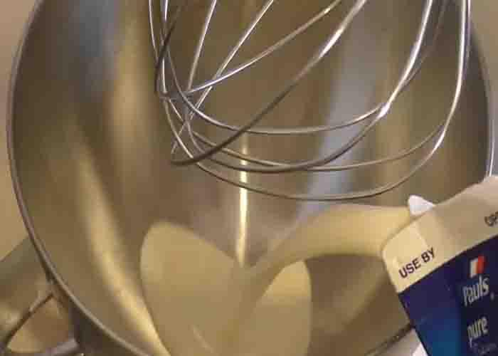 Adding the pure cream to the stand mixer