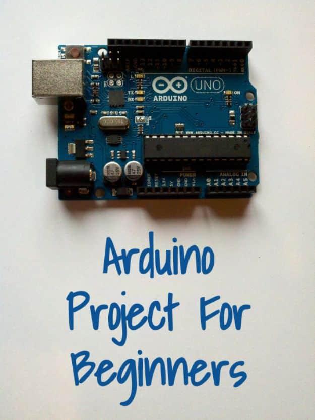 Arduino Uno board photographed from above with handwritten style text reading Arduino Project For Beginners