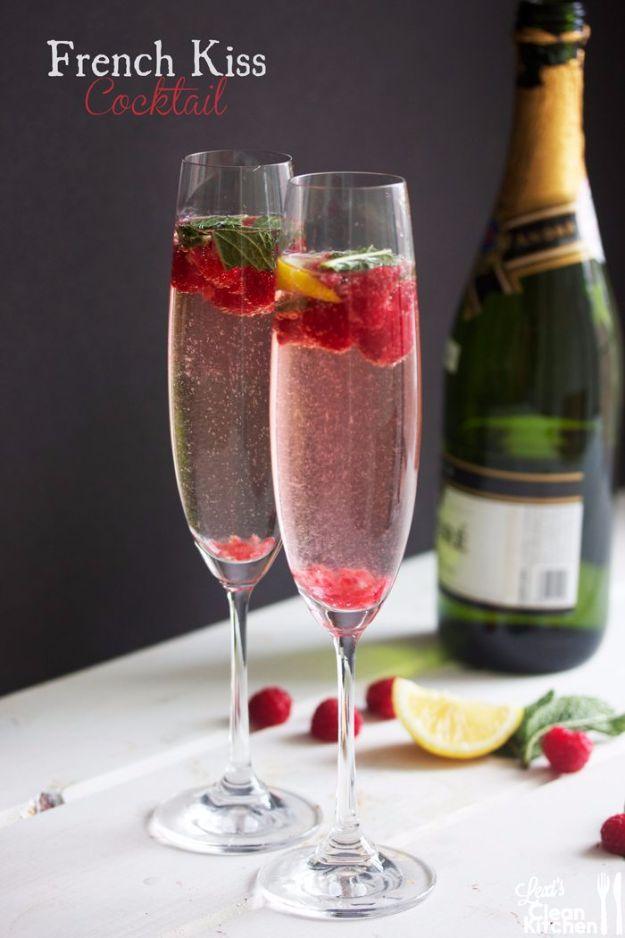 Pin graphic with French Kiss Cocktail printed top left over two flutes of raspberry champagne and a bottle