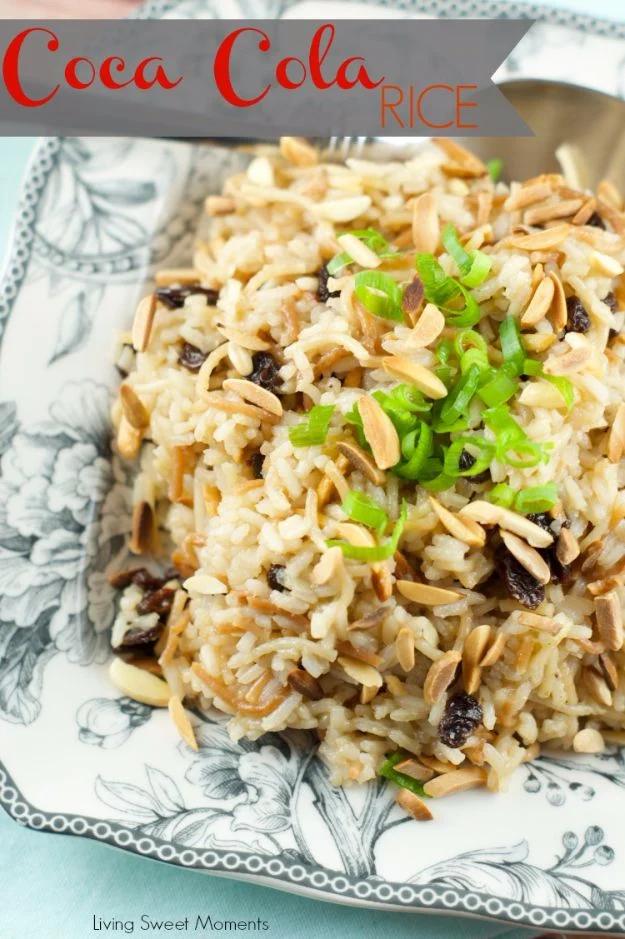Coca Cola rice topped with toasted slivered almonds, raisins and sliced green onion on a blue toile patterned plate