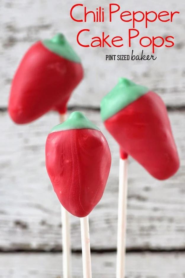 Chili pepper cake pops shaped and dipped in red candy melts with green stems for a Cinco de Mayo party