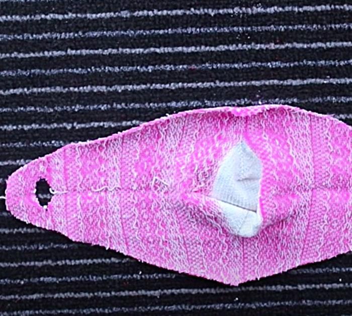 Built-in ear fasteners with a sock face mask