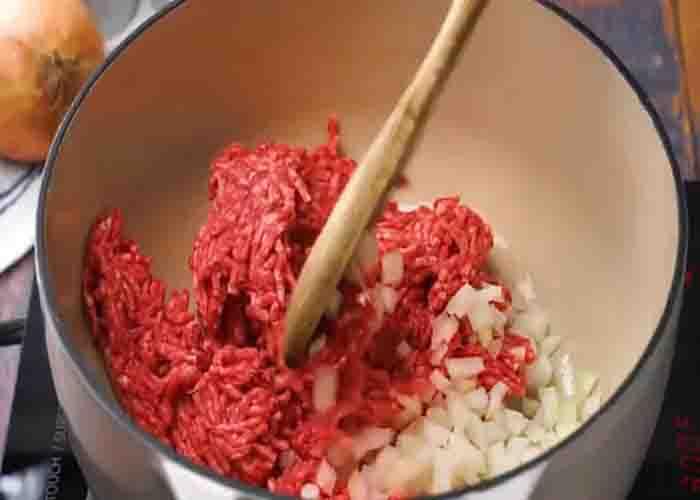 Cooking the ground beef for the cafeteria chili recipe