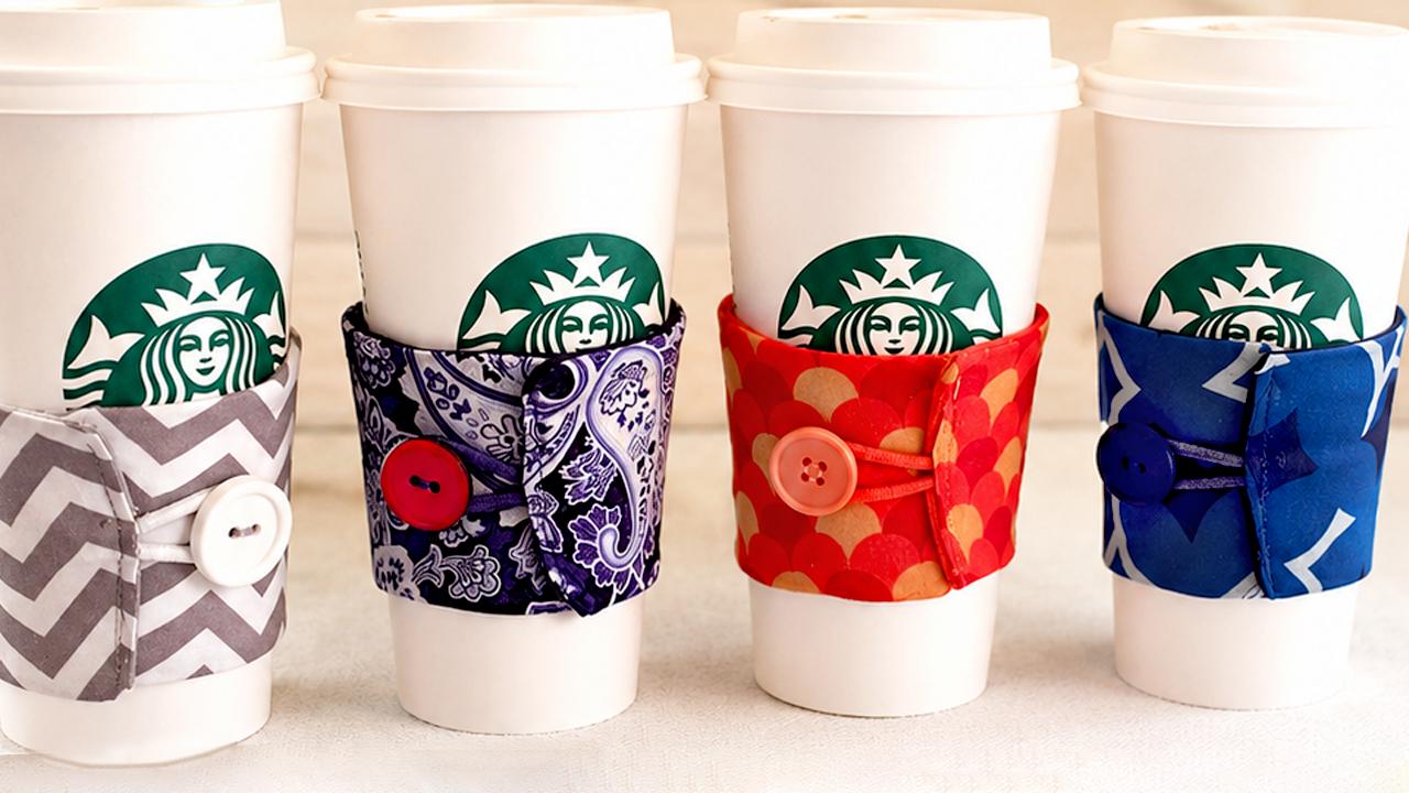 Coffee cozies sewn from fabric scraps in a rainbow of prints, a fast and quick selling sewing project