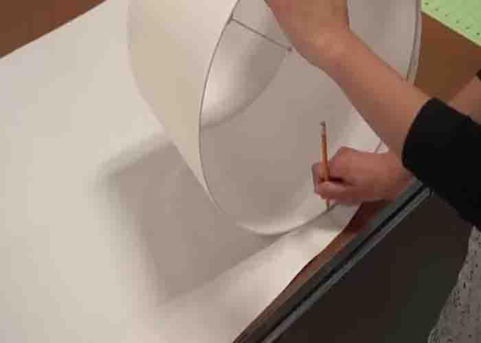 Tracing the lampshade on a tracing paper
