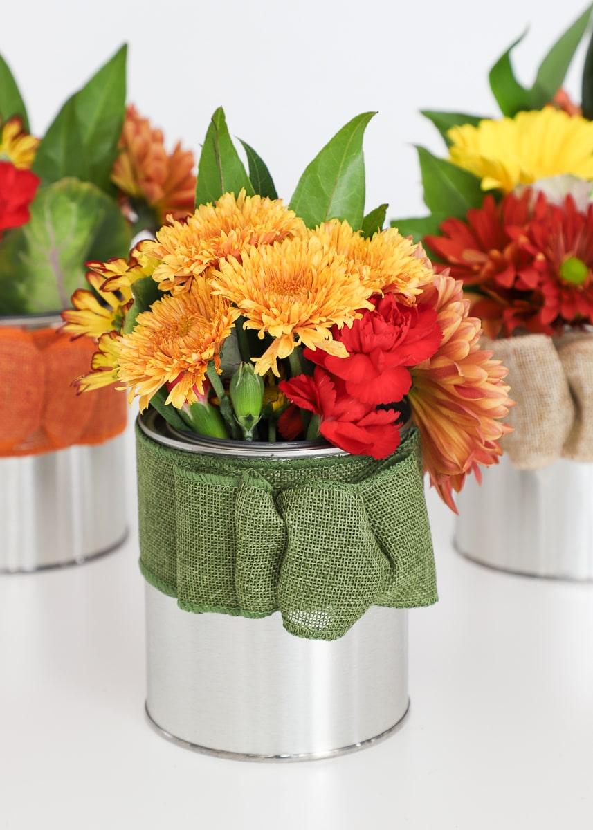 Burlap Paint Can Centerpiece, a favorite thanksgiving centerpiece idea worth copying and a popular choice on this list
