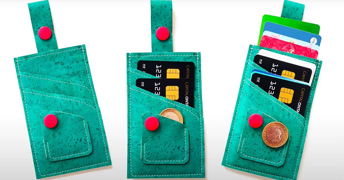 Card wallet, three teal cork card wallets with red snap tabs, one empty, one holding coins, one full of cards