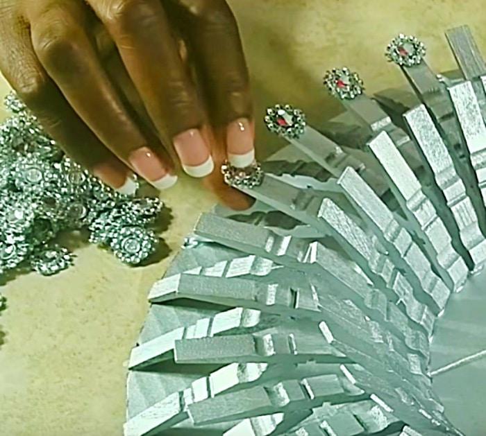 Learn to make a DIY gold clothespin mirror wall art piece for your home decor