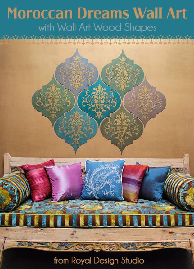 Moroccan dreams wall art graphic with teal and gold stenciled wood shapes above a jewel toned daybed