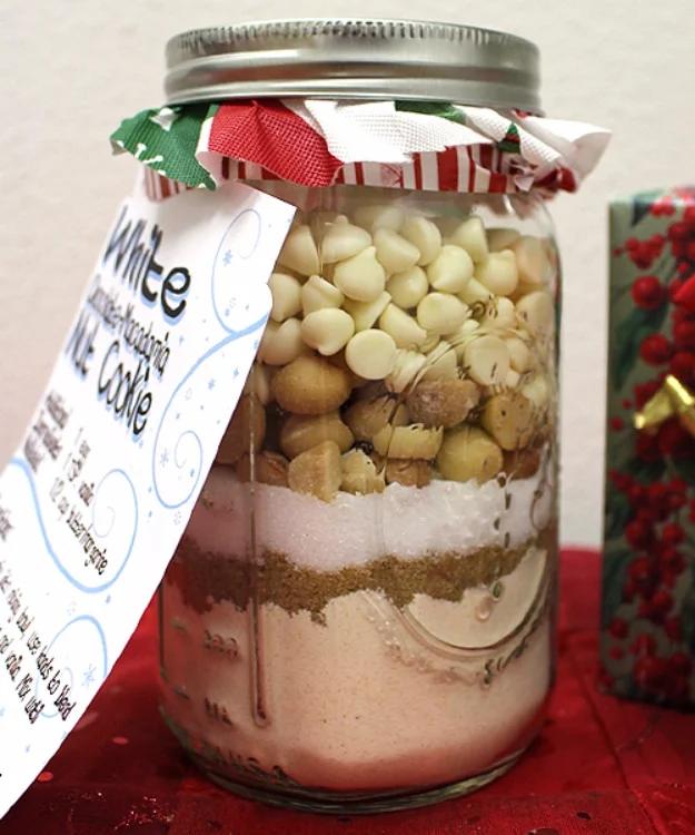 Mason jar of white chocolate macadamia nut cookie mix with a printed instruction tag tied to the lid
