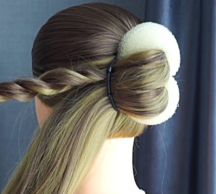 A French twist is a common "updo" hair styling technique. It is created by gathering the hair in one hand and twisting the hair upwards until it turns in on itself against the head