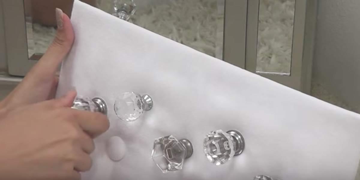 Attach Glass Knobs To A Fabric Covered Peg Board To Make This Jewelry Holder