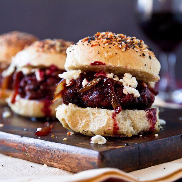 Port sliders on everything buns topped with caramelized onions, crumbled goat cheese and port reduction