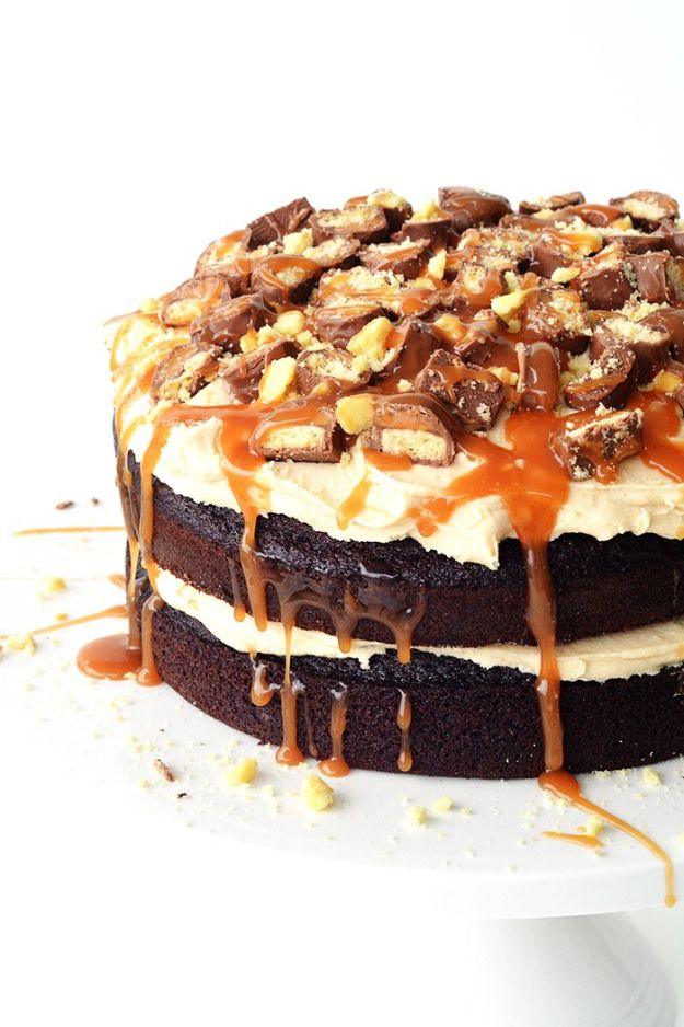 Twix chocolate layer cake with caramel filling, shortbread crumble and candy bar halves on top recipe for a celebration