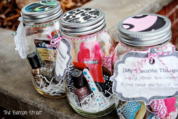 Mason jar packed with small favorite things and tied with ribbon as a personalized Valentine gift for Valentine's Day