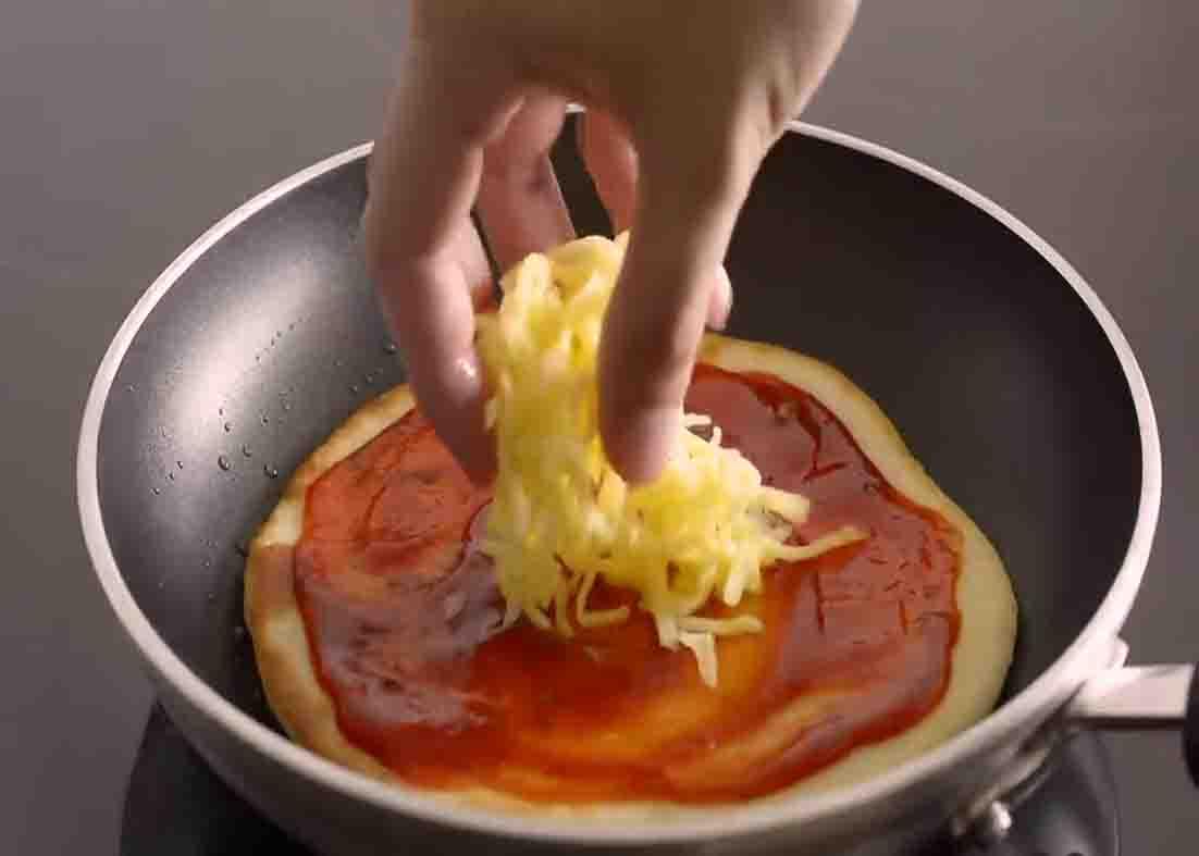Assembling the pizza in the pan