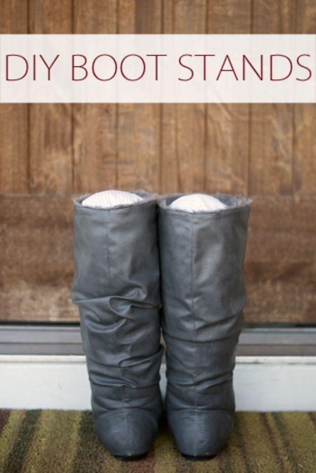 DIY boot stands, tall gray slouchy leather boots standing upright with padded white fabric boot inserts
