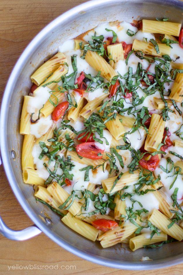 One pan caprese pasta with grape tomatoes, fresh mozzarella and torn basil cooked together with rigatoni