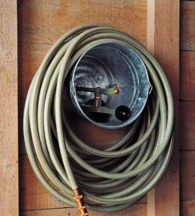 Bucket Hose Storage, simple to scale to fit almost any space and a nice way to make a plain corner feel finished