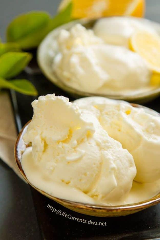 Lemon ice cream made from homemade lemon curd, scooped into a dish with lemon slices, a bright summer dessert