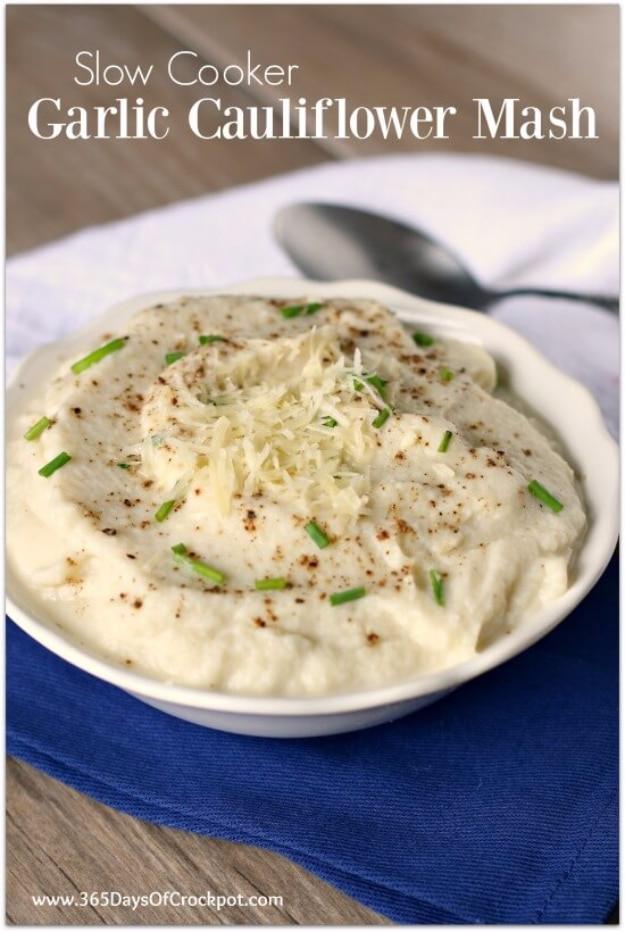White garlic cauliflower mash topped with Parmesan, chives and pepper in a bowl with recipe-title text visible