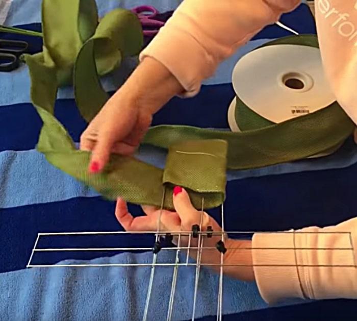 Make a cross door wreath with materials from Dollar Tree