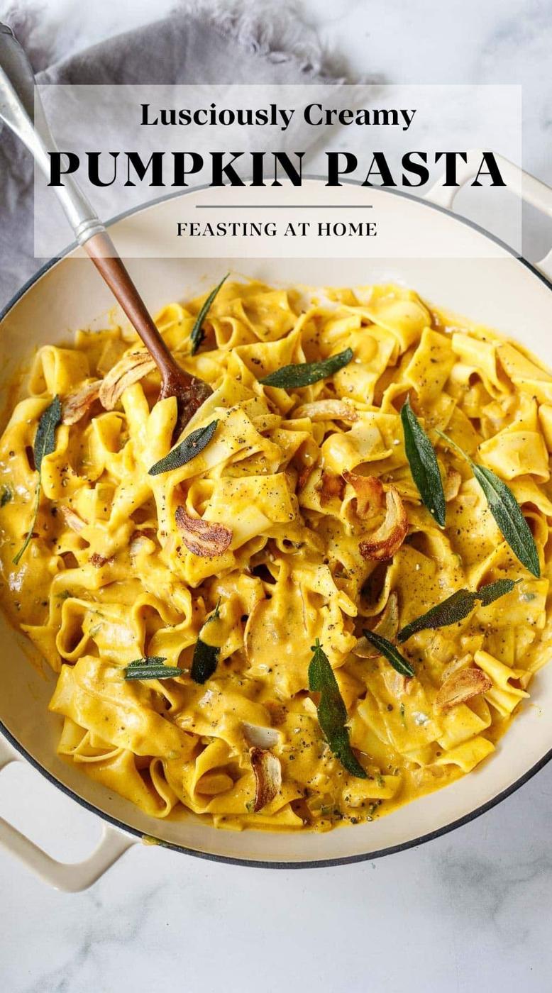 Creamy pumpkin pasta, golden orange sauce coating fettuccine with crisp sage leaves scattered over the top