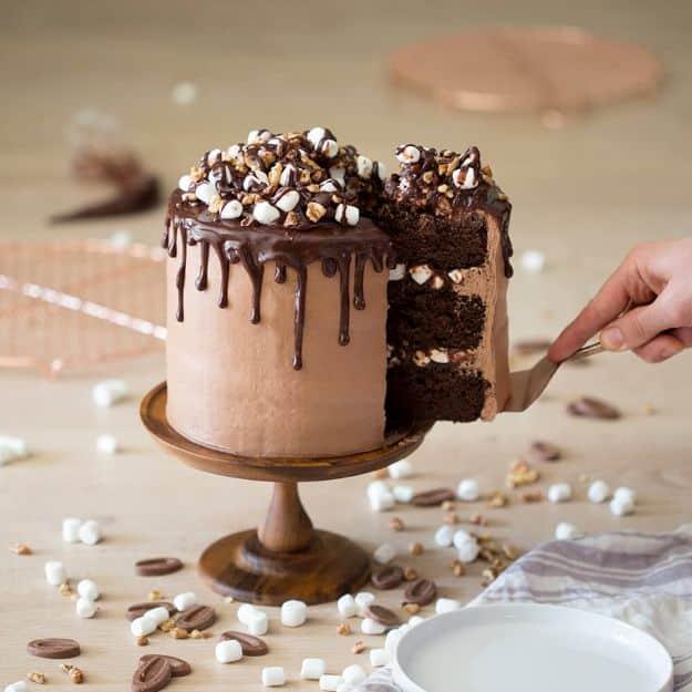 Rocky road chocolate cake with toasted marshmallows and almonds set into fudge frosting, a homemade birthday cake recipe