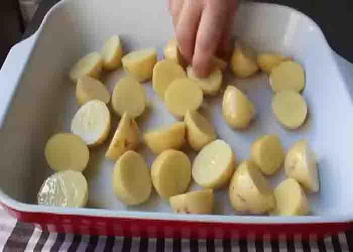 Arranging the potatoes in the casserole dish