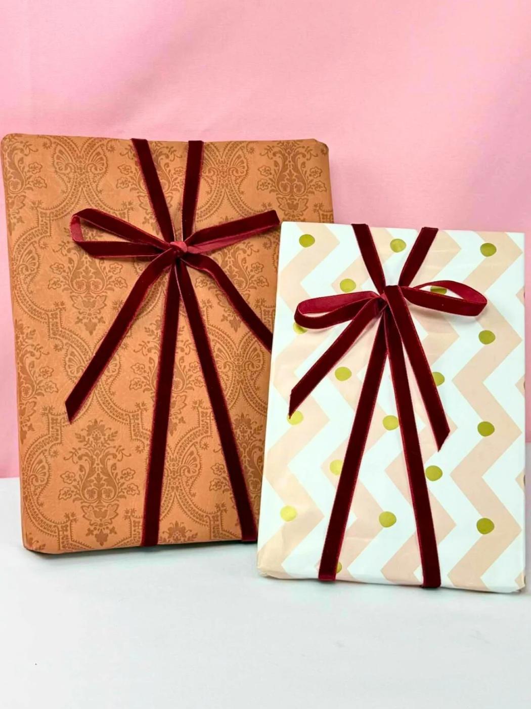 A ribbon tied neatly around a wrapped gift with an even bow that sits centered instead of sliding to one side