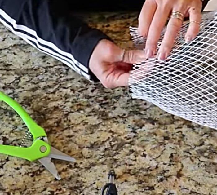 Dollar Tree DIY Ribbon Mesh Angel Using A Trash Basket and Dollar Tree Ribbon