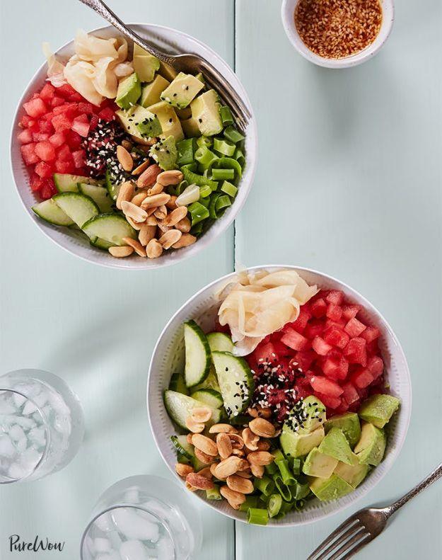 Watermelon poke bowls with cubed watermelon, avocado, cucumber, peanuts and pickled ginger in two white bowls