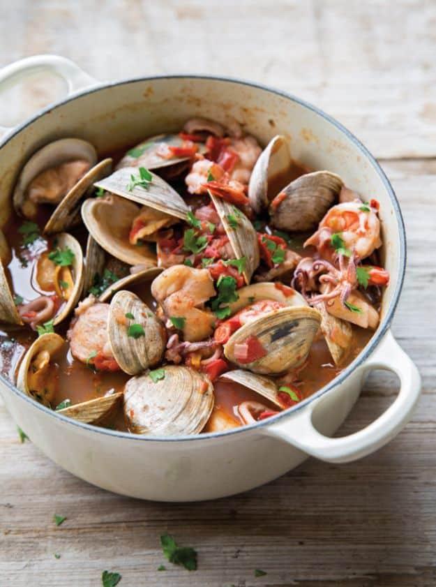 Italian shellfish stew simmered in one dutch oven with squid, clams and scallops in a tomato and red wine broth
