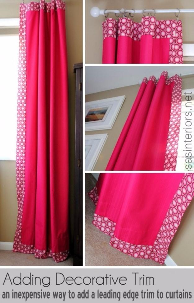 Fuchsia curtain panels edged on three sides with a white and pink patterned trim band, shown hung and laid out flat