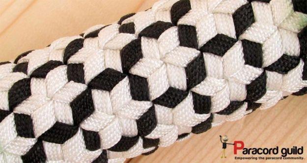 Black and cream star triaxial paracord bracelet showing the interlocking three axis star weave pattern