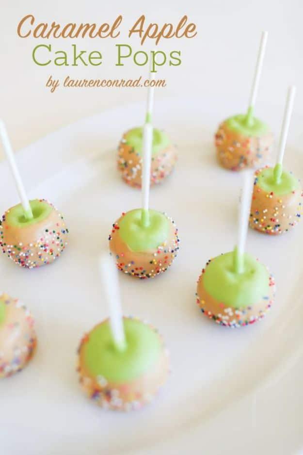 Caramel apple cake pops dipped in green and caramel candy melts with nonpareils for a fall party or a Halloween dessert table