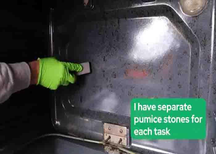 Cleaning dirty oven with pumice stone