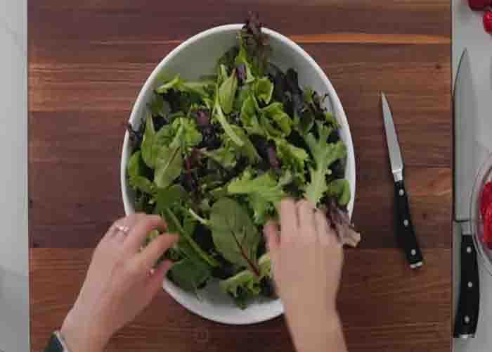 Assembling the strawberry salad recipe