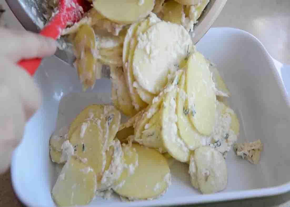 Dumping the potato mixture to the baking dish