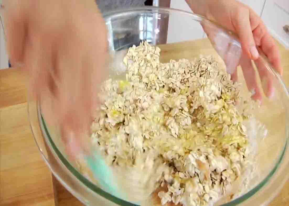 Combining all the ingredients to make the apple oatmeal cups