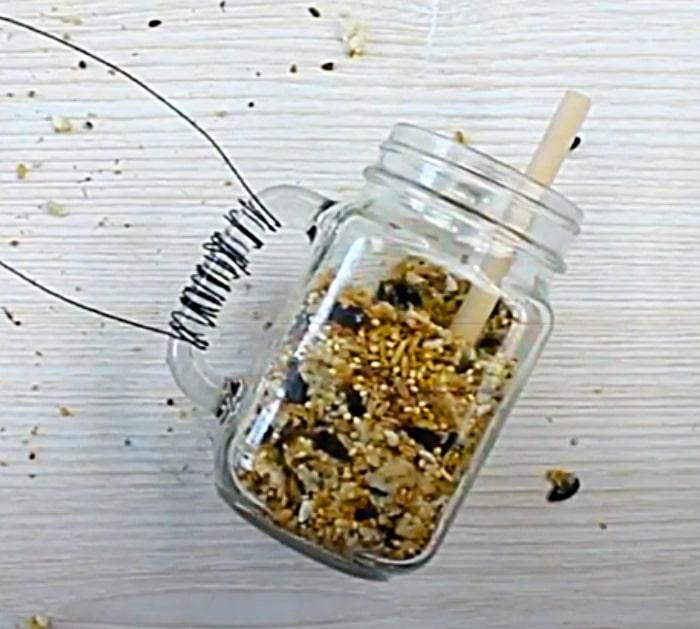 Wrap Wire Around The Handle Of A Mason Jar Bird Feeder
