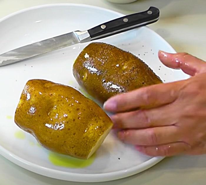How to Make Baked Potatoes at Home - Easy Baked Potato Recipe - Rub Potatoes With Olive Oil, Salt, And Pepper Then Cook In An Air Fryer