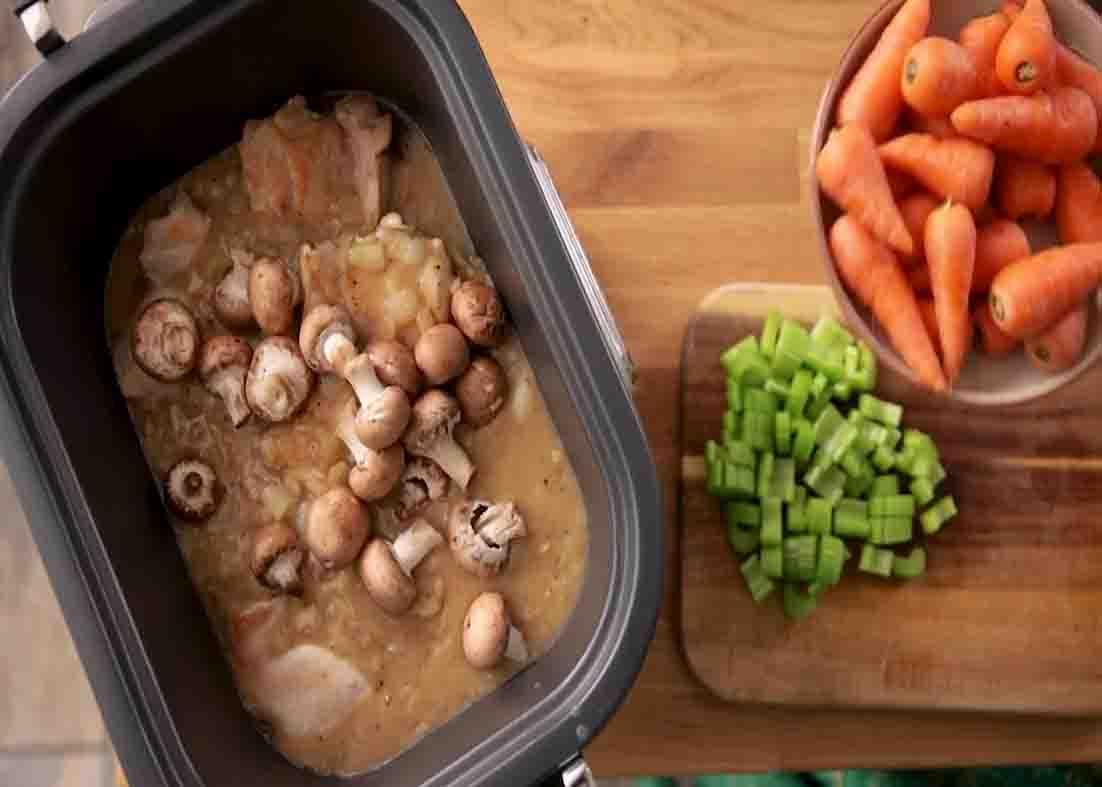 Assembling the chicken dish into the slow cooker