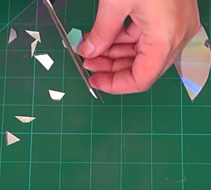 Learn to make this quick easy DIY Disco Ball Christmas Ornament using old CDs