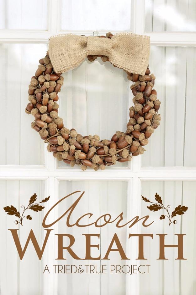 Autumn wreath with mixed size acorns clustered loosely on a visible form, a natural door wreath for a porch